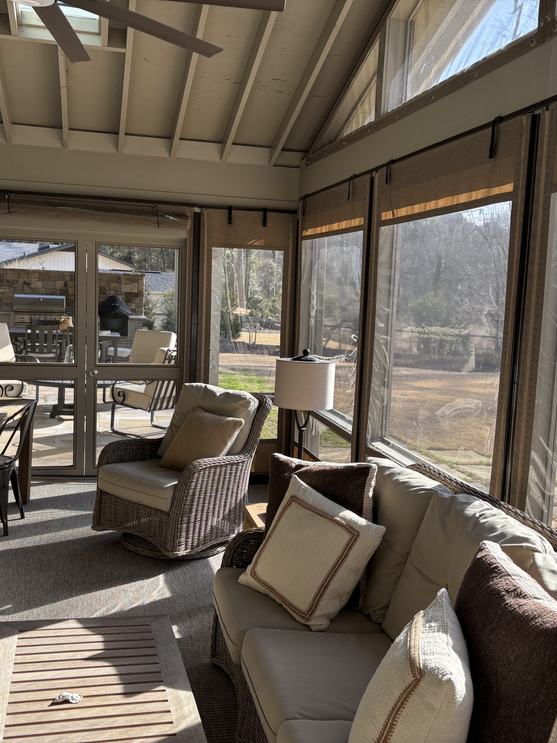 Linen Tweed Sunbrella & clear vinyl hand roll up roll up porch curtains with zipper edge closure.